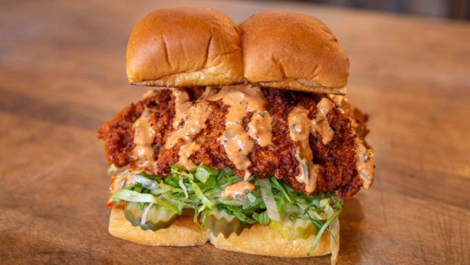 The Hot Chick · Nashville style fried chicken breast, pickles, lettuce, secret sauce; served on King's Hawaiian rolls