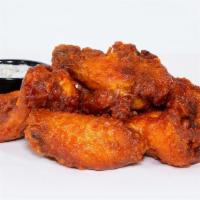 Haus Buffalo Wings · Chicken wings tossed in sriracha buffalo sauce; served with miso blue cheese