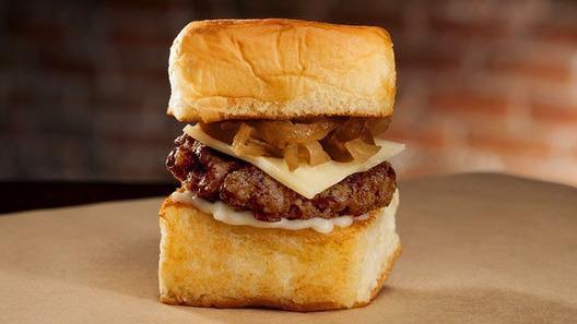 Cheeseburger Slider · 1.5oz Angus Beef, mayo, white American cheese, caramelized onions, served on a King’s Hawaiian roll.