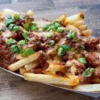 CHILI CHEESE FRIES · fries, cheddar cheese sauce, haus chili, green onions
