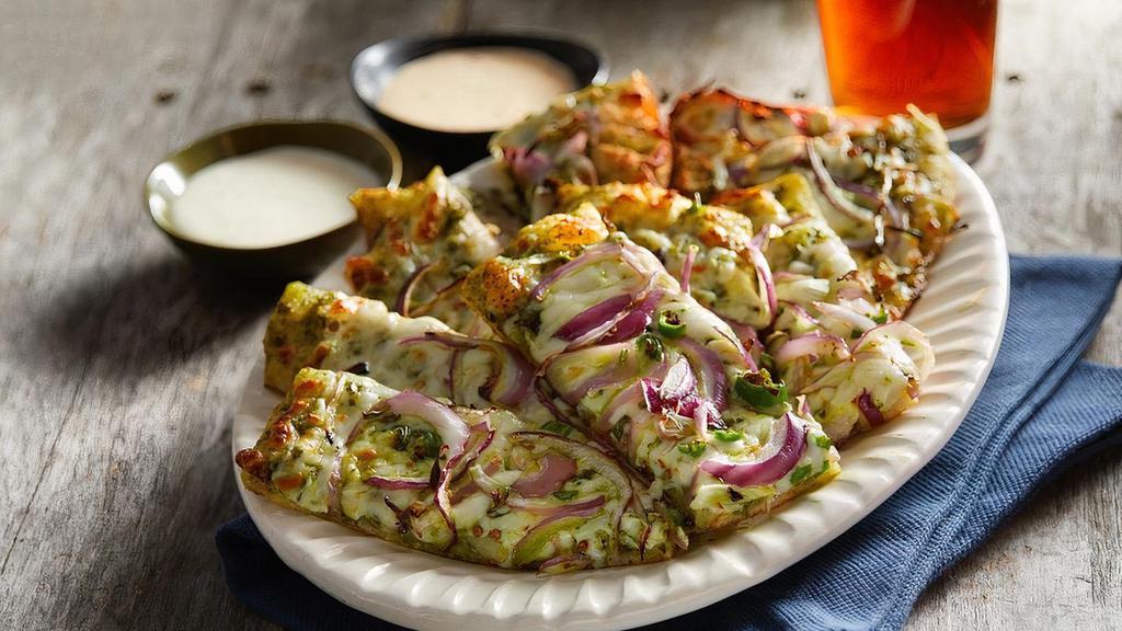 Desi Garlic Sticks · House favorite Garlic Sticks on pesto sauce topped with cheese. green chilli and red onions