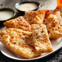 Garlic Sticks w/ Cheese · Garlic cheese sticks topped with cheese and served with two sides of ranch.