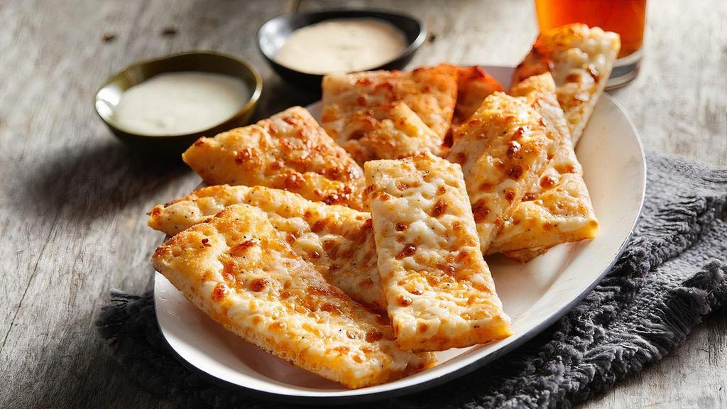 Garlic Sticks w/ Cheese · Garlic cheese sticks topped with cheese and served with two sides of ranch.