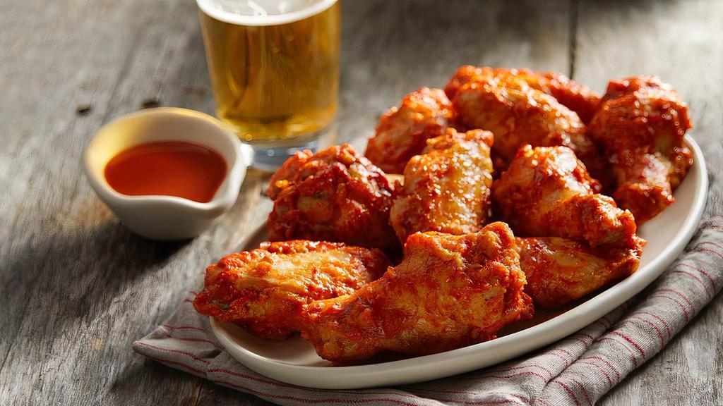 Hot Wings · Traditional bone-in wings topped with spicy buffalo hot sauce. Each 5pc wings comes with a side of ranch