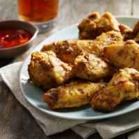 Curry Wings · Traditional bone-in wings seasoned with house blend of curry spices with sriracha drizzle al...