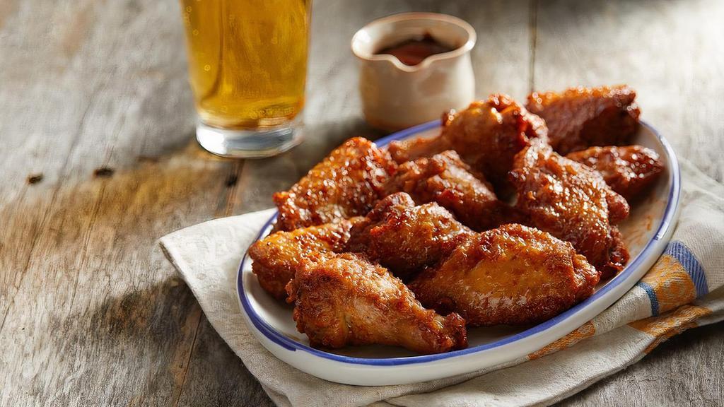 BBQ Wings · Traditional bone-in wings topped with kettle cooked original BBQ sauce. Each 5pc wings comes with a side of ranch