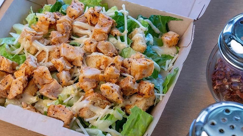 Spicy Chicken Caesar Salad · Lettuce, seasoned croutons, Parmesan cheese and caesar dressing and spicy chicken