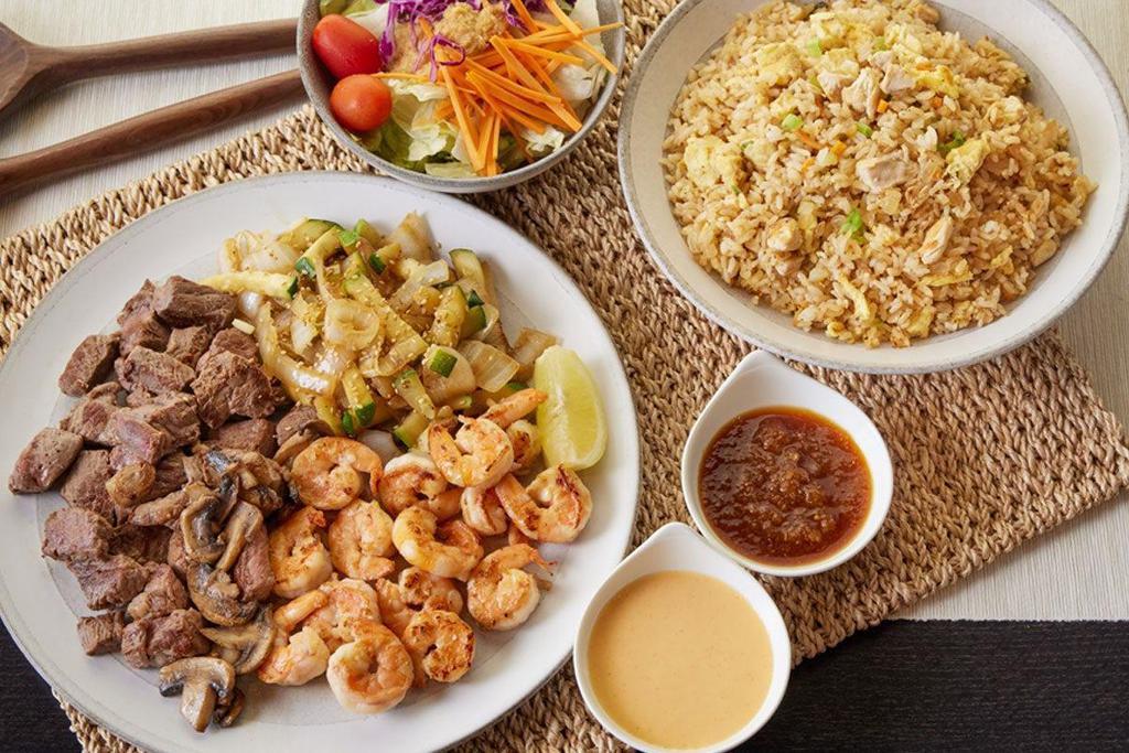 Steak* & Shrimp · Hibachi steak* and grilled shrimp lightly seasoned and grilled to your specification. Available for 2, 4 or 6! . Served with: . - House salad. - Hibachi vegetables . - Homemade dipping sauces. - Chicken Fried Rice