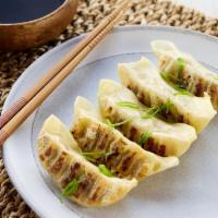 Spicy Chicken Gyoza · Spicy sesame soy dipping sauce.