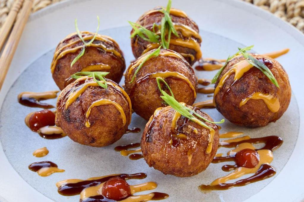 Takoyaki · Round, fried octopus with tonkatsu sauce and spicy mayo.