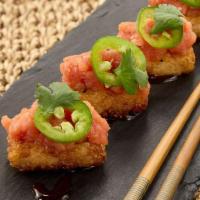 Crispy Spicy Tuna* · Crunchy sesame rice balls, jalapenos, cilantro, drizzled with soy chili sauce.