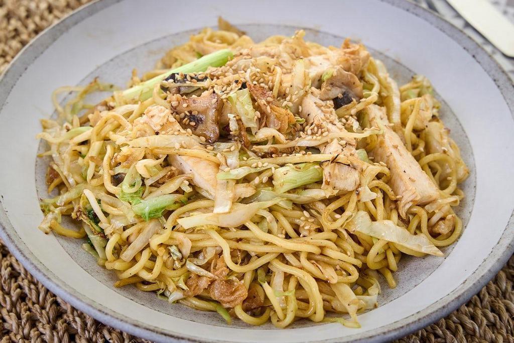 Chicken Yakisoba Bowl · Japanese sautéed noodles with chicken and mixed vegetables in a special sauce and sprinkled with sesame seeds.