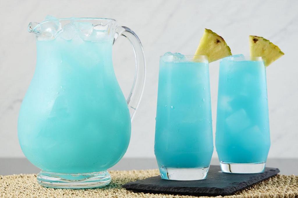 Blue Lagoon Punch  · A tropical blue concoction with RumHaven Coconut Rum, New Amsterdam Pineapple Vodka, sake, blue curaçao and tropical fruit juices.. *Don't forget to add ice when your drink arrives!