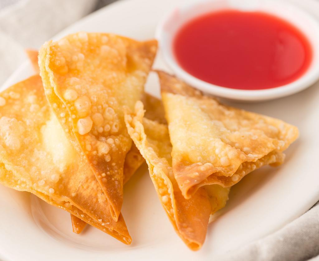 Fried Stuffed Wonton (10) · Stuffed with cream cheese served with sweet and sour sauce on the side.