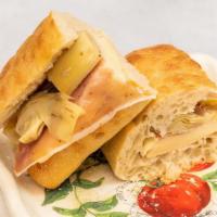 Artichoke Prosciutto panino · Fontina Cheese, Prosciutto di Parma, Artichoke hearts, EVO Oil