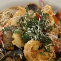 63. Sea Food Pasta · Prawns, scallop, mussels, clams, olives. Artichoke in homemade red sauce served w/ Capellini...