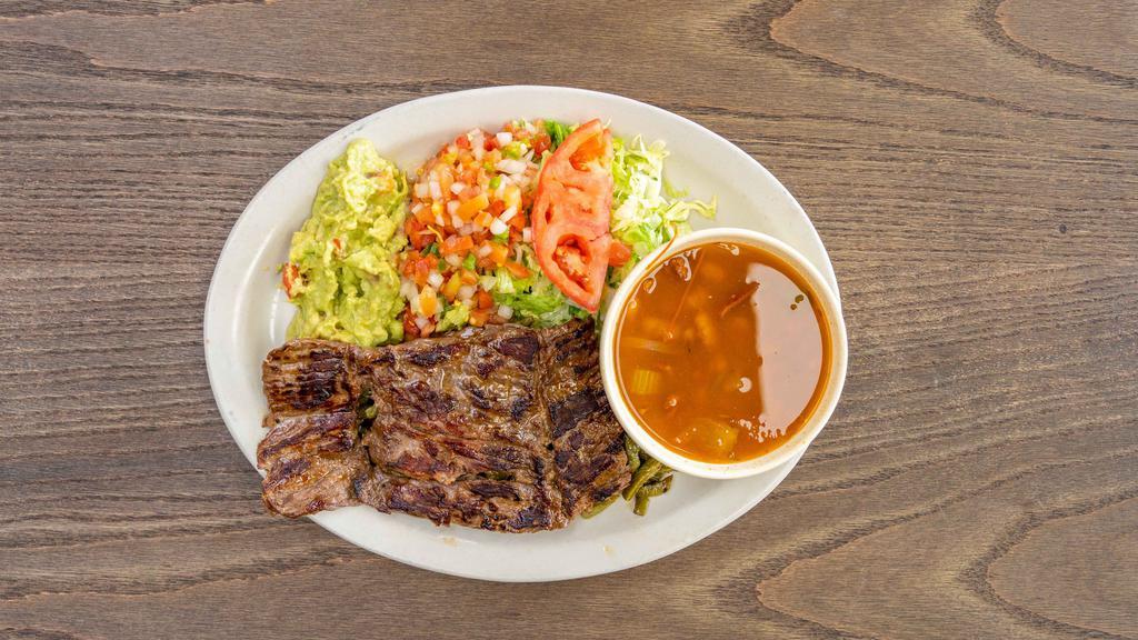 Carne Asada · All dinner plates are served with rice and refried beans. Grilled skirt steak, refried beans, Spanish rice, sliced avocado, house salad, nopalitos salsa tequila borracha sauce, queso fresco.