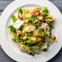 Caesar Salad · Crispy romaine lettuce topped with herb croutons and fresh grated parmesan cheese, served wi...