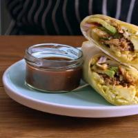 Roast Pork Breakfast Burrito · Two scrambled eggs, roast pork, tater tots, and melted cheese wrapped in a fresh flour torti...