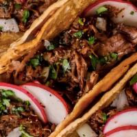 Soft Barbacoa Taco · Soft Beef Stew Tacos topped off with Cilantro and Onions.