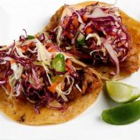 Tacos de Pescado (2) · Alaska cod , beer batter, chipotle, aioli, jalapeño slaw