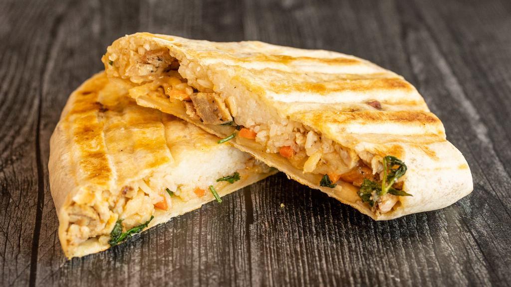 Bánh Mì Burrito · Grilled lemongrass chicken, jasmine rice, pickled carrots, daikon, cilantro, jalapeño peppers, toasted flour tortilla.