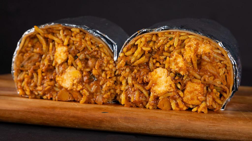 Tikka Masala Burrito · Our iconic tikka masala with choice of protein, rice, chana garbanzo masala, and sliced onions, wrapped up in a tortilla.