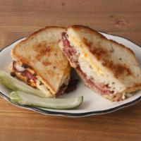 The OG Reuben * · *Now with 20% more meat!* choice of pastrami, corned beef, or smoked turkey griddled with ru...