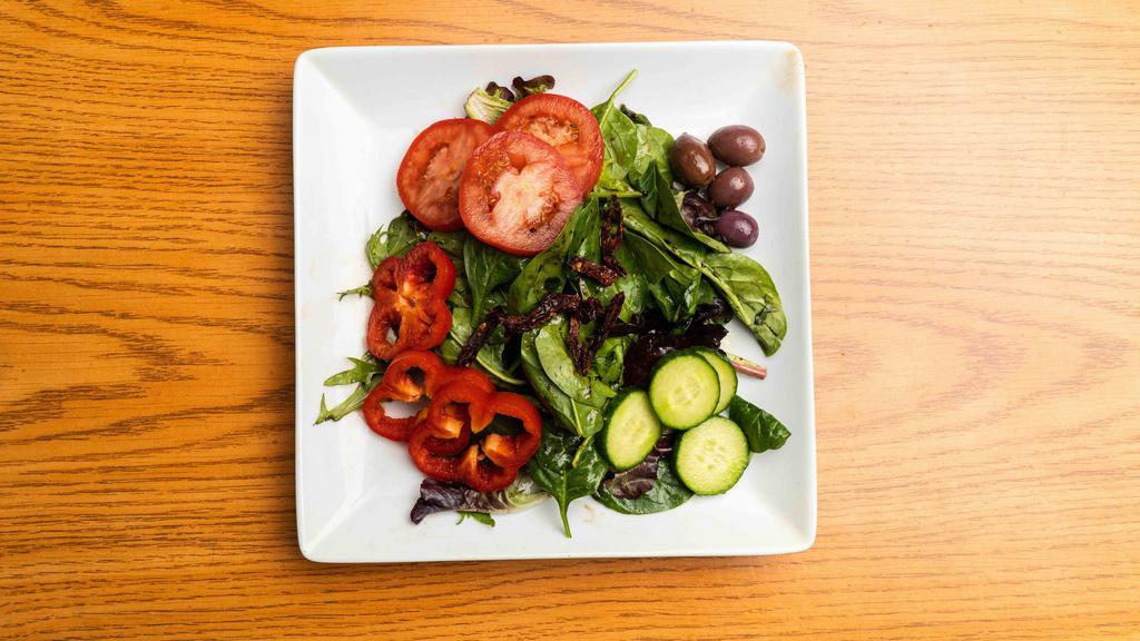 House salad · Organic mixed  greens with tomatoes, cucumber, olives, and peppers in balsamic Italian dressing