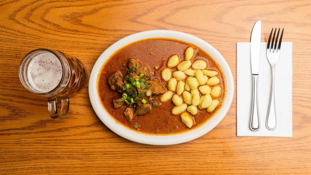 Paprika goulash · Traditional slow cooked  pork stew with organic broth, paprika and other spices.Served with potato gnocchi and local bread
