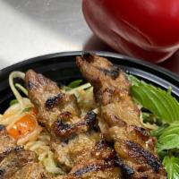 Papaya Salad with Beef Skewers · Tri-tip marinated with Cambodian BBQ sauce, char broiled. Served with papaya salad. Papaya s...