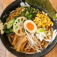 Yuzu Ramen · Soy sauce-based chicken broth with a hint of Japanese yuzu citrus topped with braised pork b...