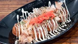 Takoyaki · A Japanese street festival favorite octopus balls, topped with dried bonito flakes, seaweed ...