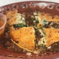 Quesabirria · Corn Tortilla, Monterey Jack Cheese, Birria Meat, onions, cilantro. Free consome with order