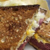 Reuben · Corned beef, swiss cheese, kraut, russian dressing, on rye. Served with house made potato ch...
