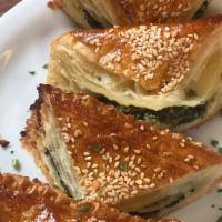 Spanakopita · Traditional phyllo dough filled with spinach and feta cheese.