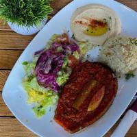 Stuffed Eggplant Plate · Rice and salad only. Baked eggplant stuffed with ground beef, tomato,onions, garlic and bell...