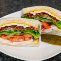 Club Sandwich · Fresh-cut turkey, crunchy bacon, with bread, cheese, and produce.