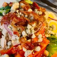 Cobb Salad · Romaine lettuce, tomato, onion, bell pepper, cucumber, blue cheese crumbles, boiled egg, fre...