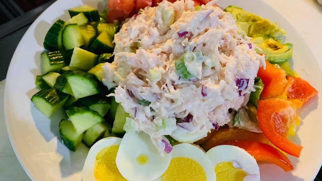 Chicken Salad Salad · Chicken salad mixed with chopped celery & onion on top of romaine lettuce, tomato, cucumber bell pepper, boiled egg.
