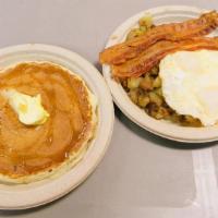 1. The Bountiful Breakfast · Served with 2 Eggs Any Style & Potatoes.  Choice of  Pancake,  French Toast or Toast. Choice...