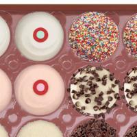 Assorted Dozen Box · variety box features our best selling cupcake flavors. 2 red velvet, 2 black & white, 2 stra...
