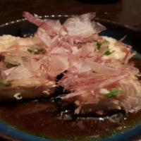 Agedashi Tofu · Soft tofu coated with potato starch and deep fried,  daily fresh grated  daikon, ginger,  sc...