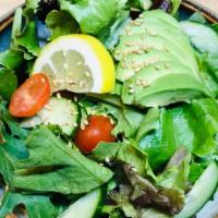 Mixed Green Salad · Mixed green salad, sliced avocado, small tomato limited, homemade vinegar salad dressing.