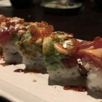 Goemon Roll · Spicy. Unagi and cucumber, topped with tuna, avocado, snow crab, tobiko, sweet sauce and spi...