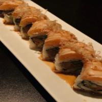 Salmon Lover Roll · Seared salmon,  avocado and cucumber , topped with seared salmon, bonito, scallion and sweet...