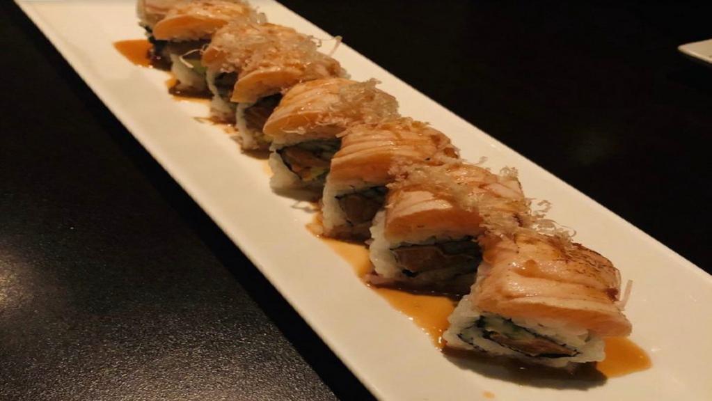 Salmon Lover Roll · Seared salmon,  avocado and cucumber , topped with seared salmon, bonito, scallion and sweet sauce.