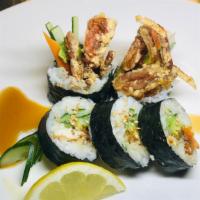 Spider Roll · Fried soft shell crab, avocado, cucumber, tobiko, scallions, sweet sauce, and sesame seeds.