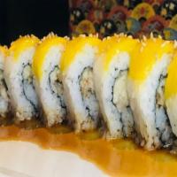 Tropical Roll · Unagi and macadamia nuts, topped with fresh mango, sweet sauce and sesame seeds.