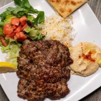 Chabli Kabab · Grounded beef, rice, salad, hummus and pita.
